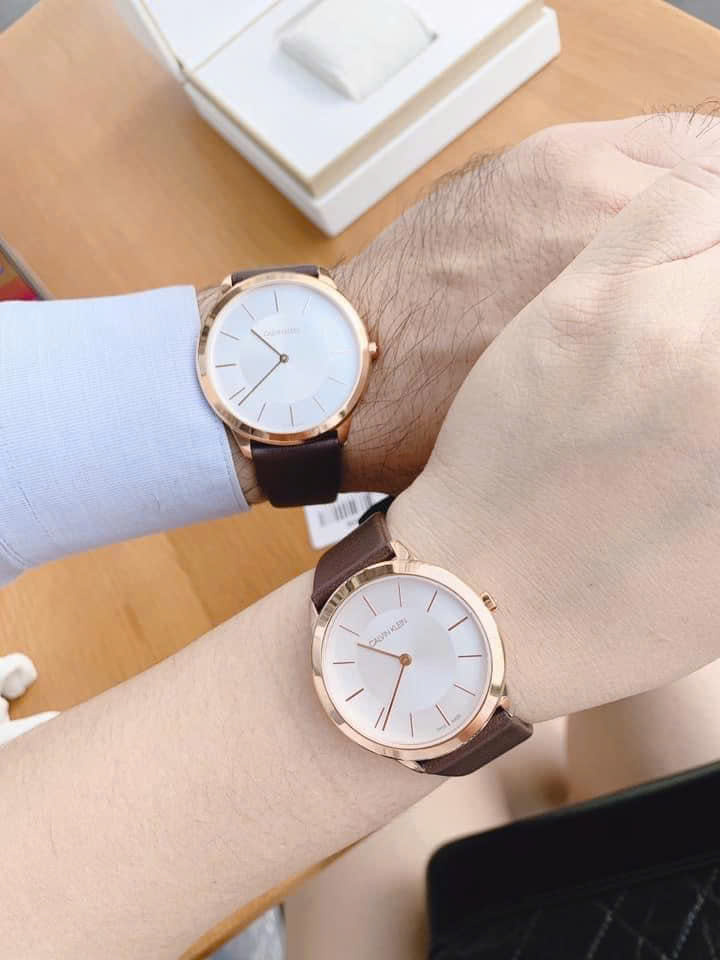 Đồng Hồ Đôi Calvin Klein Minimal K3M226G6 & K3M216G6 – Dây Da Nâu, Viền Gold, Mặt Trắng Thanh Lịch