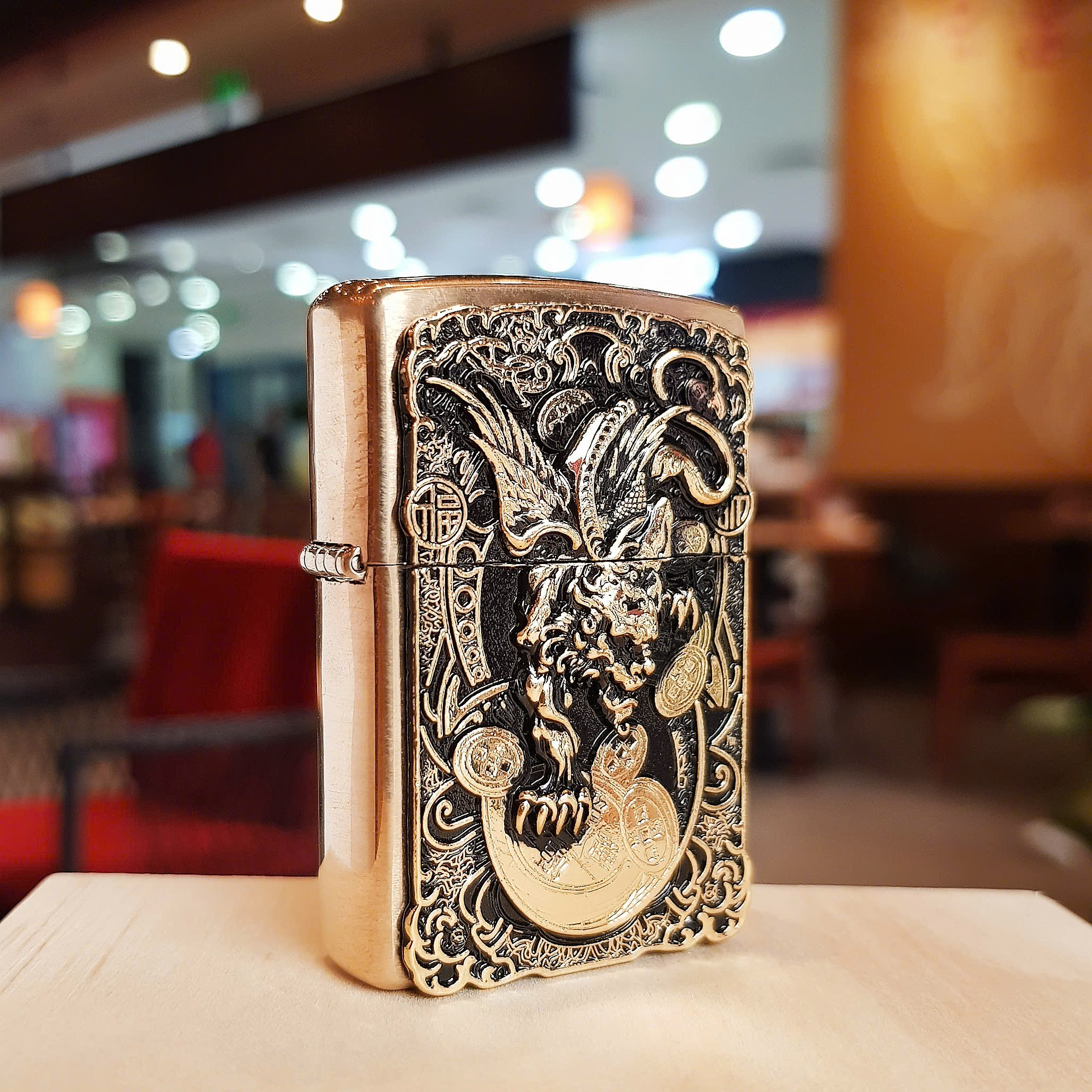 Bật lửa Zippo Kỳ lân ngậm kim tiền – Biểu tượng tài lộc và may mắn