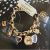 Đồng Hồ Dạng Lắc Anne Klein Women's 10-7604CHRM Swarovski Crystal Gold-Tone Charm Bracelet Watch